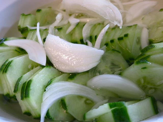 This cucumber salad is so easy to make and is refreshing on a hot, summer day. It's pretty and delicious, making it surprising that it requires only 5 ingredients!  #WomenLivingWell #salad #cucumber #easyrecipes