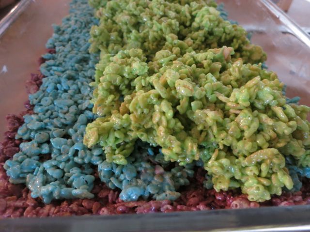These Rainbow Rice Krispie treats are perfect for St Patrick's Day, bake sales, birthday parties, or just an everyday fun treat for kids! #womenlivingwell #desserts #ricekrispietreats #easyrecipes