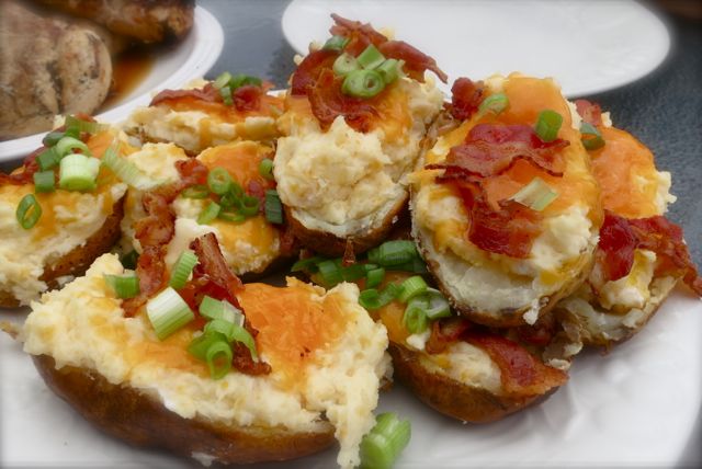 These twice baked potatoes are easy to make and the most delicious ones you'll try. Cheese, sour cream, bacon and a secret ingredient for the ultimate yum! #easyrecipe #potato #sidedish